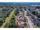 Aerial view of a residential neighborhood near a lake at 117 Red Rose Cir, Orlando, FL 32835