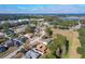 Aerial view showcasing a residential area with houses and green spaces at 117 Red Rose Cir, Orlando, FL 32835