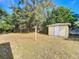 Large backyard with shed and mature trees at 117 Red Rose Cir, Orlando, FL 32835