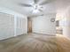 Primary bedroom with white closet and ceiling fan at 117 Red Rose Cir, Orlando, FL 32835