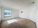 Bright and airy bedroom with neutral walls and carpeted floor at 117 Red Rose Cir, Orlando, FL 32835