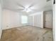 Bedroom with window, carpet, and white closet doors at 117 Red Rose Cir, Orlando, FL 32835