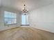 Bright dining room with chandelier and view of entryway at 117 Red Rose Cir, Orlando, FL 32835