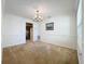 Spacious dining room with chandelier and neutral carpeting at 117 Red Rose Cir, Orlando, FL 32835