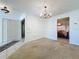 Spacious dining room with chandelier and neutral carpeting at 117 Red Rose Cir, Orlando, FL 32835