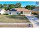 House exterior with solar panels and driveway at 117 Red Rose Cir, Orlando, FL 32835