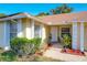 House exterior with a covered entry and landscaping at 117 Red Rose Cir, Orlando, FL 32835