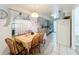 Eat-in kitchen with wood table and chairs, plus a view into the adjacent living area at 117 Red Rose Cir, Orlando, FL 32835