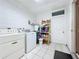 Clean laundry room with washer, dryer, and storage at 117 Red Rose Cir, Orlando, FL 32835