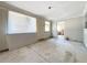 Spacious living room with large windows and view into kitchen at 117 Red Rose Cir, Orlando, FL 32835