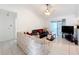 Spacious living room with a ceiling fan, tiled floors and access to a patio at 117 Red Rose Cir, Orlando, FL 32835
