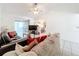 Living room features a ceiling fan, tiled floors, and comfortable seating at 117 Red Rose Cir, Orlando, FL 32835