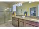 Modern bathroom with double sinks and a walk-in shower at 1636 Moon Valley Dr, Davenport, FL 33896