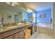 Double vanity bathroom with soaking tub and shower at 1636 Moon Valley Dr, Davenport, FL 33896