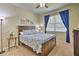 Cozy bedroom with a double bed and blue curtains at 1636 Moon Valley Dr, Davenport, FL 33896