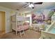 Bunk beds, castle mural, and princess-themed decor at 1636 Moon Valley Dr, Davenport, FL 33896