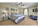 Bright bedroom with king-size bed and TV at 1636 Moon Valley Dr, Davenport, FL 33896