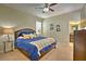 Spacious Primary bedroom with a king-size bed and blue bedding at 1636 Moon Valley Dr, Davenport, FL 33896