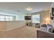 Spacious bonus room with sofa, beanbag chairs, and large TV at 1636 Moon Valley Dr, Davenport, FL 33896