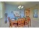 Bright dining area with a wood table and six chairs at 1636 Moon Valley Dr, Davenport, FL 33896