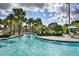 Community lazy river with a wooden bridge and slide at 1636 Moon Valley Dr, Davenport, FL 33896