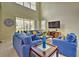 Spacious living room with sectional sofa and high ceilings at 1636 Moon Valley Dr, Davenport, FL 33896