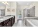 Elegant bathroom with double vanity, soaking tub, and separate shower at 1804 Gobi Dr, Kissimmee, FL 34747
