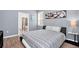 Bedroom with a queen bed, gray walls, and en-suite bathroom at 1804 Gobi Dr, Kissimmee, FL 34747