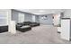 Spacious living room with gray sectional sofa and plush carpeting at 1804 Gobi Dr, Kissimmee, FL 34747