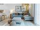 Cozy living room with sectional sofa, pillows and large artwork at 2381 Penguin Blvd, Davenport, FL 33837