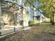 Screened patio and fenced backyard with lush landscaping at 2766 White Isle Ln, Orlando, FL 32825