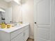 Simple bathroom featuring a white vanity and gold accents at 2766 White Isle Ln, Orlando, FL 32825