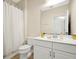 Clean bathroom with white vanity and gold accents at 2766 White Isle Ln, Orlando, FL 32825