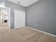 Spacious bedroom with gray walls, carpet, and a large closet at 2766 White Isle Ln, Orlando, FL 32825