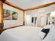 Main bedroom with a wooden canopy bed and ensuite bathroom at 2766 White Isle Ln, Orlando, FL 32825
