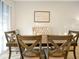 Bright dining room featuring a wood table and upholstered bench at 2766 White Isle Ln, Orlando, FL 32825