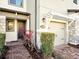 Townhome entry with paver walkway, stone accents and landscaping at 2766 White Isle Ln, Orlando, FL 32825