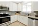 Modern kitchen with granite countertops and stainless steel appliances at 2766 White Isle Ln, Orlando, FL 32825
