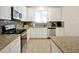 Modern kitchen with granite countertops and stainless steel appliances at 2766 White Isle Ln, Orlando, FL 32825