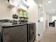 Convenient laundry room with washer, dryer, and storage shelves at 2766 White Isle Ln, Orlando, FL 32825