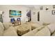 Open living room with sectional sofa and tile floors at 2766 White Isle Ln, Orlando, FL 32825