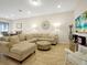 Spacious living room with sectional sofa and tile floors at 2766 White Isle Ln, Orlando, FL 32825