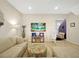 Open living room with sectional sofa and tile floors at 2766 White Isle Ln, Orlando, FL 32825