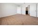 Bedroom with carpet, and en-suite bathroom access at 418 Caraway Dr, Kissimmee, FL 34759