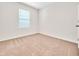 Bright bedroom with carpeted floor and window with blinds at 418 Caraway Dr, Kissimmee, FL 34759