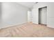Well-lit bedroom featuring carpeted floors and ample closet space at 418 Caraway Dr, Kissimmee, FL 34759