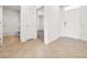Bright entryway with tile flooring and neutral colors, showcasing a bathroom and bedroom access at 418 Caraway Dr, Kissimmee, FL 34759