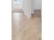 Light hallway with neutral tile floors leading to carpeted rooms at 418 Caraway Dr, Kissimmee, FL 34759