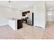 Open kitchen features stainless steel appliances and an island at 418 Caraway Dr, Kissimmee, FL 34759