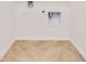 Simple laundry room with light beige flooring at 418 Caraway Dr, Kissimmee, FL 34759